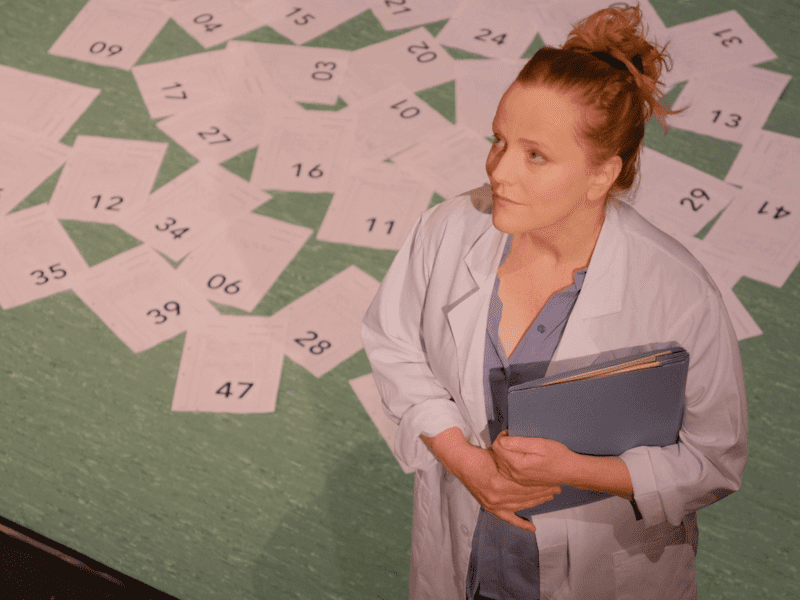 Doctor with files surrounding her